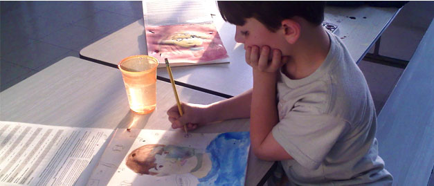 child painting watercolors